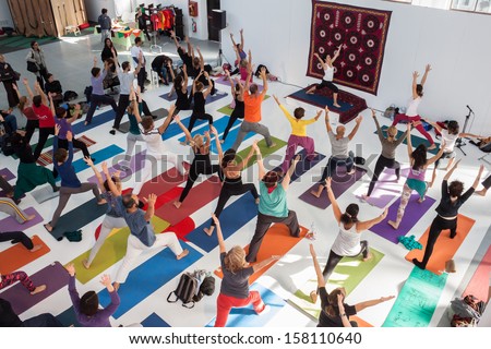 Milan, Italy - October 11: People Take A Class At Yoga Festival 2013, Event Dedicated To Yoga, Meditation And Healthy Lifestyle On October 11, 2013 In Milan.