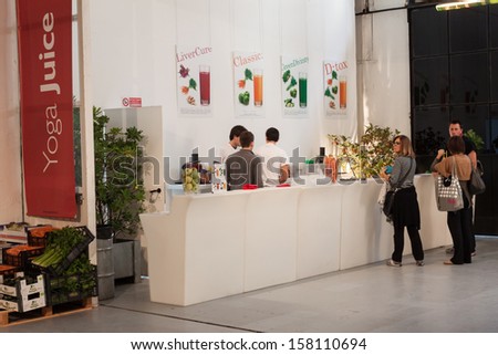 MILAN, ITALY - OCTOBER 11: Fruit juice bar at Yoga Festival 2013, event dedicated to yoga, meditation and healthy lifestyle on OCTOBER 11, 2013 in Milan.