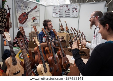 MILAN, ITALY - OCTOBER 20: Guitars on display at Milano Guitars & Beyond 2013, important trade show of string instruments with specific attention to guitars on OCTOBER 20, 2013 in Milan.