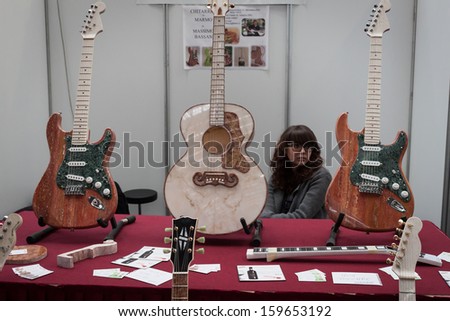 MILAN, ITALY - OCTOBER 20: Marble guitars at Milano Guitars & Beyond 2013, important trade show of string instruments with specific attention to guitars on OCTOBER 20, 2013 in Milan.