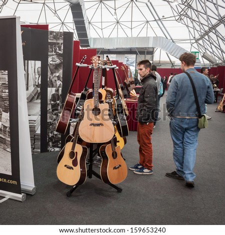 MILAN, ITALY - OCTOBER 20: Classical guitars at Milano Guitars & Beyond 2013, important trade show of string instruments with specific attention to guitars on OCTOBER 20, 2013 in Milan.