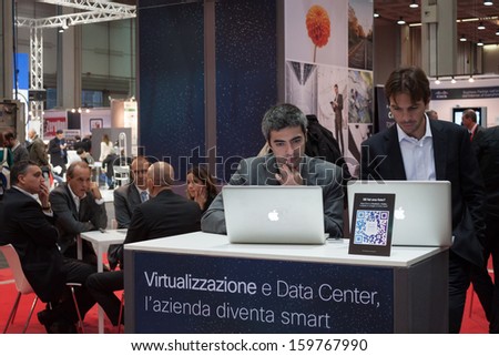 MILAN, ITALY - OCTOBER 23: People visit Smau, international exhibition of information communications technology on OCTOBER 23, 2013 in Milan.