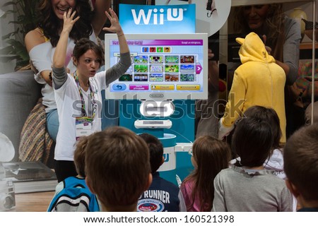 MILAN, ITALY - OCTOBER 26: People visit Games Week 2013, event dedicated to video games and electronic entertainment on OCTOBER 26, 2013 in Milan.