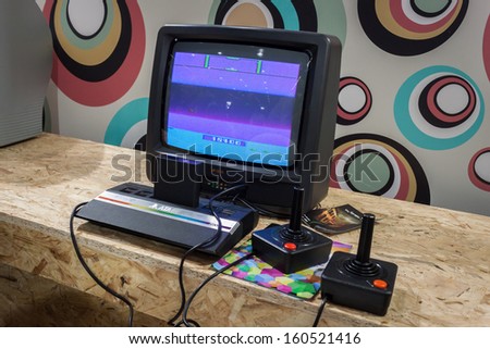 MILAN, ITALY - OCTOBER 26: Atari retro console at Games Week 2013, event dedicated to video games and electronic entertainment on OCTOBER 26, 2013 in Milan.