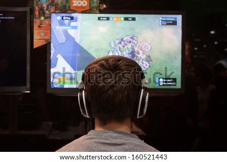 MILAN, ITALY - OCTOBER 26: A boy plays at Games Week 2013, event dedicated to video games and electronic entertainment on OCTOBER 26, 2013 in Milan.