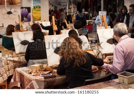 Milan, Italy - November 1: People Take A Painting At Weekend Donna 2013, Event Dedicated To Women And Their Passions On November 1, 2013 In Milan.