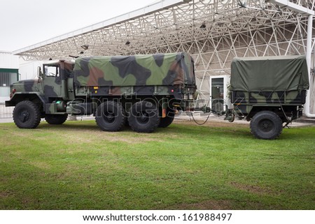 MILAN, ITALY - NOVEMBER 2: Huge military truck with trailer at Militalia, exhibition dedicated to militaria collectors and military associations on NOVEMBER 2, 2013 in Milan.