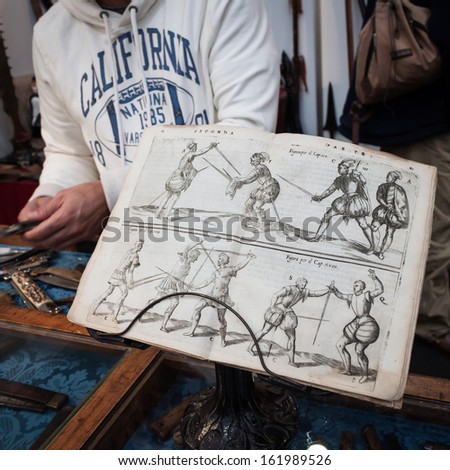 MILAN, ITALY - NOVEMBER 2: Antique fencing book on display at Militalia, exhibition dedicated to militaria collectors and military associations on NOVEMBER 2, 2013 in Milan.