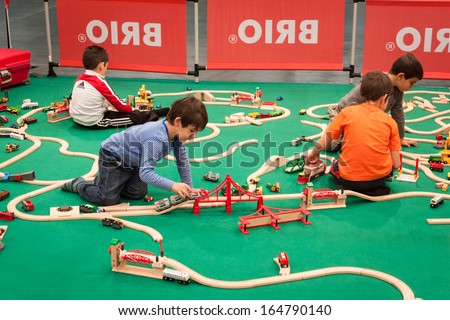 MILAN, ITALY - NOVEMBER 22: Children play at G! come giocare, trade fair dedicated to games, toys and children on NOVEMBER 22, 2013 in Milan.