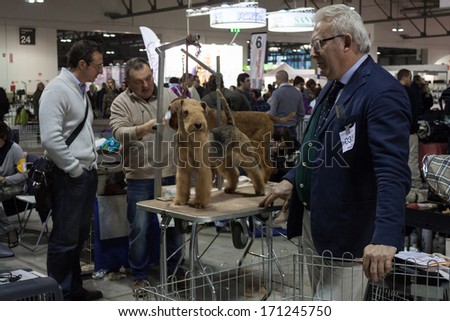 MILAN, ITALY - JANUARY 11: People and dogs take part in the international dogs exhibition of Milan, the most important dog show in Italy, on JANUARY 11, 2014 in Milan.