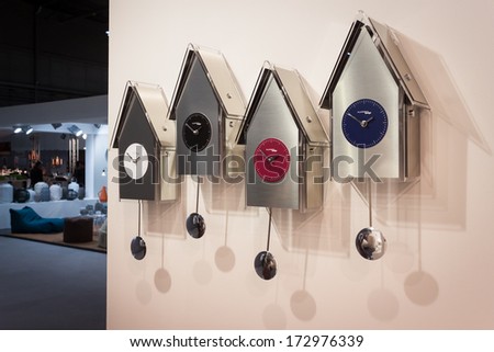MILAN, ITALY - JANUARY 20: Modern pendulum clocks on display at HOMI, home international show and point of reference for all those in the sector of interior design on JANUARY 20, 2014 in Milan.