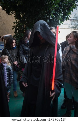 MILAN, ITALY - JANUARY 26: People of 501st Legion, official costuming organization, take part in the Star Wars Parade wearing perfectly accurate costumes on JANUARY 26, 2013 in Milan.