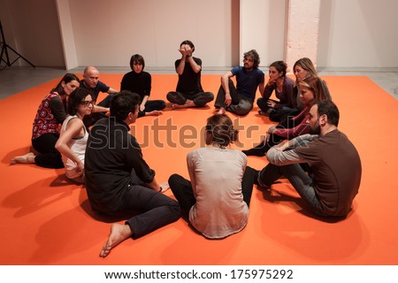 MILAN, ITALY - FEBRUARY 7: People take a class of body awareness at Olis Festival, event dedicated to holistic disciplines, alternative medicine and natural food on FEBRUARY 7, 2014 in Milan.