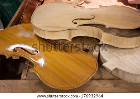 MILAN, ITALY - FEBRUARY 13: Violins under construction at Bit, international tourism exchange reference point for the travel industry on FEBRUARY 13, 2014 in Milan.