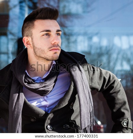 Portrait of a handsome young man with scarf