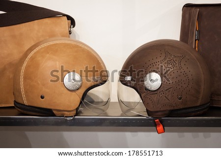 MILAN, ITALY - FEBRUARY 22: Leather covered helmets on display at Mipap, international presentation of women\'s pret-a-porter and accessories on FEBRUARY 22, 2014 in Milan.