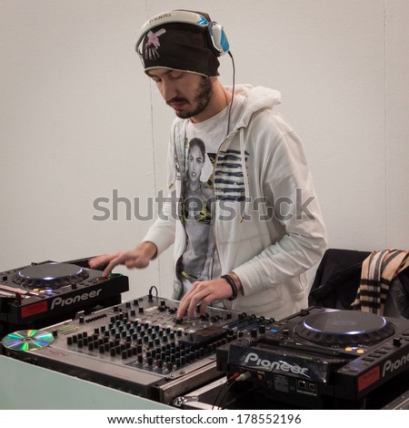 MILAN, ITALY - FEBRUARY 22: Dj set entertains people at Mipap, international presentation of women\'s pret-a-porter and accessories on FEBRUARY 22, 2014 in Milan.