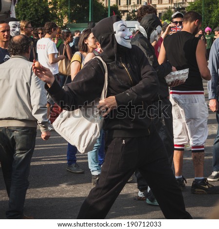 MILAN, ITALY - MAY 1: Protester throws an egg during Mayday parade, event to celebrate the international Workers\' Day on MAY 1, 2014 in Milan.