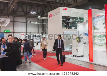 MILAN, ITALY - MAY 7: People visit Solarexpo, international exhibition for promoting innovative and renewable energy technology on MAY 7, 2014 in Milan.