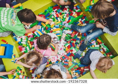 MILAN, ITALY - MAY 10: Children play at Lego Village, event held in the city streets to promote creativity and manual ability on MAY 10, 2014 in Milan.