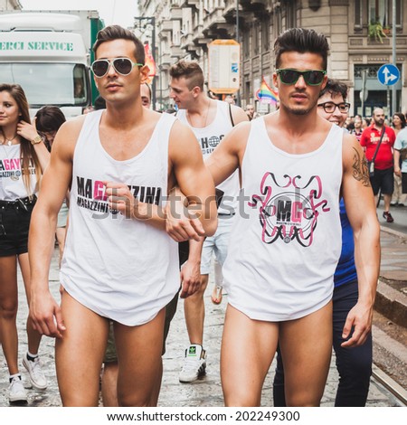 MILAN, ITALY - JUNE 28: People at gay pride parade in Milan JUNE 28, 2014. Thousands of people march in the city streets for the annual gay pride parade, claiming equality and legal rights.