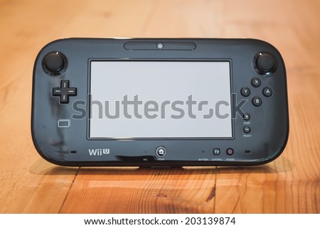 MILAN, ITALY - JULY 3, 2014: Close up of black Nintendo Wii U gamepad device. Nintendo is the world\'s largest video game company by revenue.
