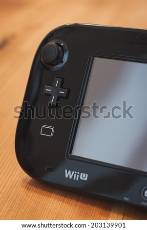 MILAN, ITALY - JULY 3, 2014: Close up of black Nintendo Wii U gamepad device. Nintendo is the world\'s largest video game company by revenue.