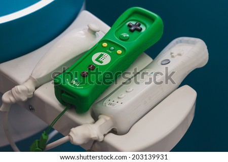 MILAN, ITALY - JULY 3, 2014: Close up of Nintendo Wii controllers. Nintendo is the world\'s largest video game company by revenue.