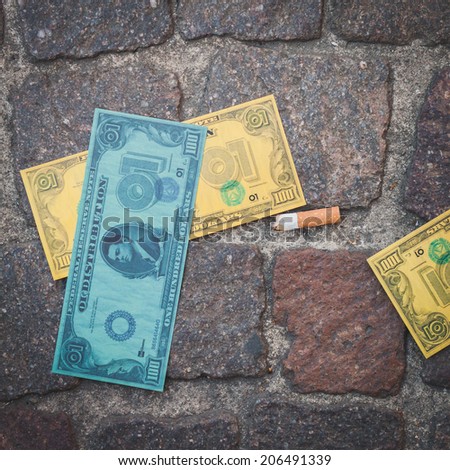 MILAN, ITALY - JULY 16: Detail of fake dollars used in a flash mob to promote the official launch of The Wolf of Wall Street on DVD and Blue-Ray on July 16, 2014 in Milan.