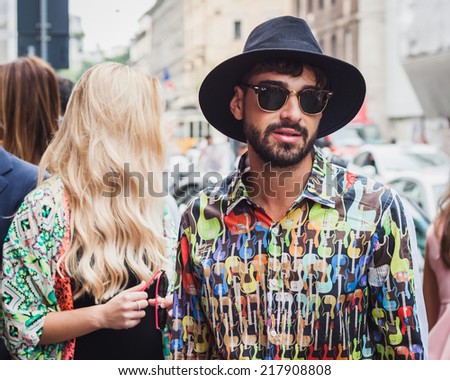 MILAN, ITALY - SEPTEMBER 17: Man poses outside Byblos fashion shows building for Milan Women\'s Fashion Week on SEPTEMBER 17, 2014 in Milan.