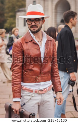 MILAN, ITALY - SEPTEMBER 20: Man poses outside Cavalli fashion shows building for Milan Women\'s Fashion Week on SEPTEMBER 20, 2014 in Milan.