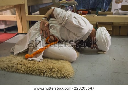 MILAN, ITALY - OCTOBER 10: Yogi practicing at Yoga Festival, event dedicated to yoga, meditation and healthy lifestyle on OCTOBER 10, 2014 in Milan.
