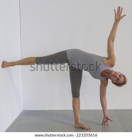 MILAN, ITALY - OCTOBER 10: Woman takes a class at Yoga Festival, event dedicated to yoga, meditation and healthy lifestyle on OCTOBER 10, 2014 in Milan.