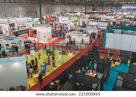 MILAN, ITALY - OCTOBER 17: Top view of people and booths at Viscom, international trade fair and conference on visual communication and event services on OCTOBER 17, 2014 in Milan.