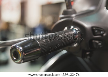 MILAN, ITALY - NOVEMBER 5: Detail of Vespa scooter handle at EICMA, international motorcycle exhibition on NOVEMBER 5, 2014 in Milan.