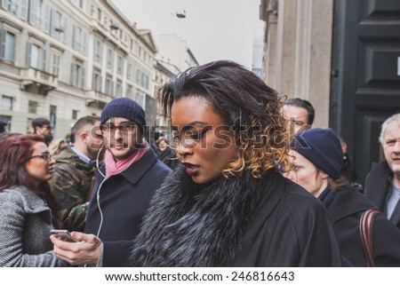 MILAN, ITALY - JANUARY 20: People gather outside Cavalli fashion show building for Milan Men's Fashion Week on JANUARY 20, 2015 in Milan.