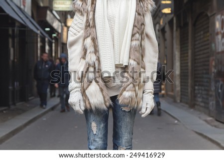 Detail of a young woman with ecological fur in the city streets - Concept of cruelty free fashion clothing