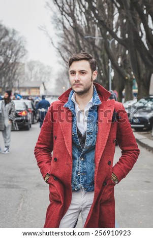 MILAN, ITALY - FEBRUARY 27: Man poses outside Armani fashion show building for Milan Women\'s Fashion Week on FEBRUARY 27, 2015  in Milan.