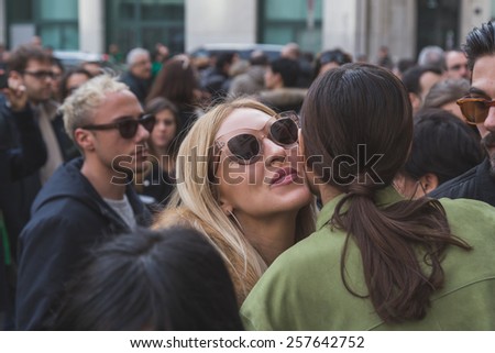 MILAN, ITALY - MARCH 1: People gather outside Ferragamo fashion show building for Milan Women\'s Fashion Week on MARCH 1, 2015  in Milan.