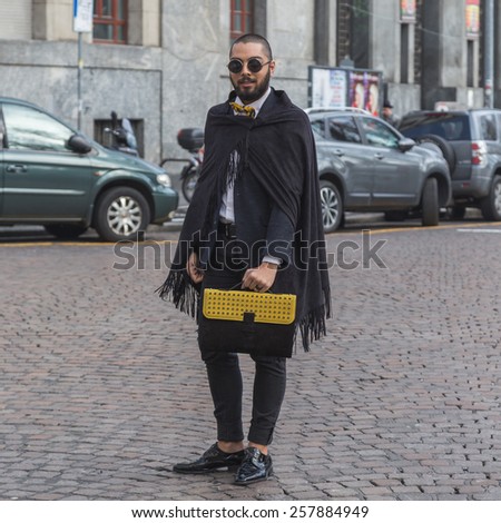 MILAN, ITALY - MARCH 2: Man poses outside Alberto Zambelli fashion show building for Milan Women's Fashion Week on MARCH 2, 2015  in Milan.