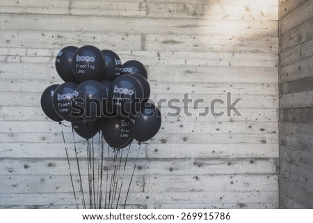 MILAN, ITALY - APRIL 15: Black balloons for Fuorisalone at Ventura Lambrate space, location of important events during Milan Design Week on APRIL 15, 2015 in Milan.