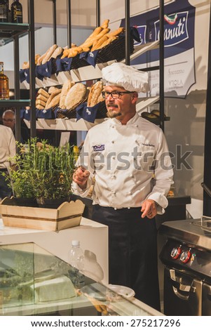 MILAN, ITALY - MAY 4: Cook working at Tuttofood, world food exhibition on MAY 4, 2015 in Milan.