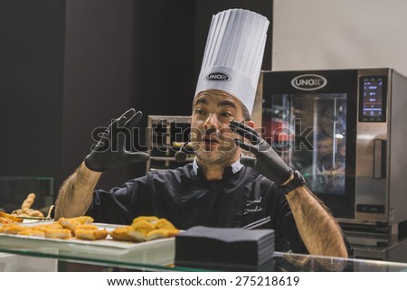 MILAN, ITALY - MAY 4:  Cook working at Tuttofood, world food exhibition on MAY 4, 2015 in Milan.