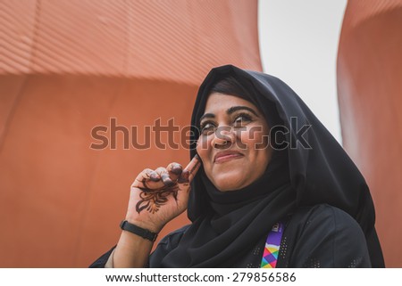 MILAN, ITALY - MAY 19: Woman working for United Arab Emirates pavilion at Expo, universal exposition on the theme of food on MAY 19, 2015 in Milan.
