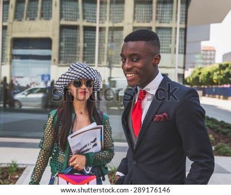 MILAN, ITALY - JUNE 20: People gather outside Costume National fashion show building for Milan Men\'s Fashion Week on JUNE 20, 2015 in Milan.