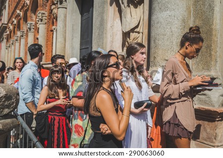MILAN, ITALY - JUNE 21: People gather outside Missoni fashion show building for Milan Men\'s Fashion Week on JUNE 21, 2015 in Milan.
