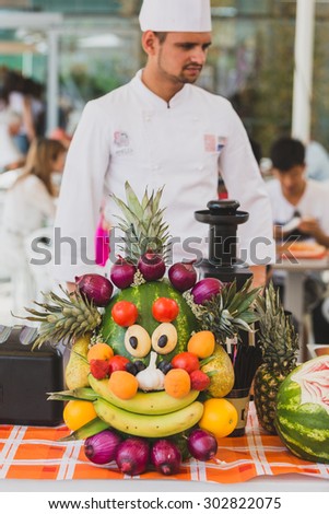 MILAN, ITALY - JULY 29: Cook with mascot Foody at Expo, universal exposition on the theme of food on JULY 29, 2015 in Milan.