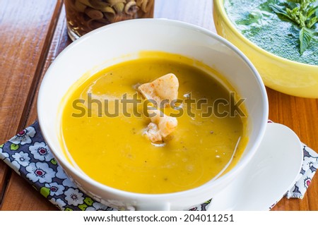 PUmpkin soup in white cup