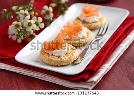 Canapes with oat bran cookies, smoked salmon and cream cheese