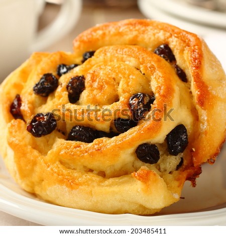Fresh gluten free sweet swirl bun with raisins